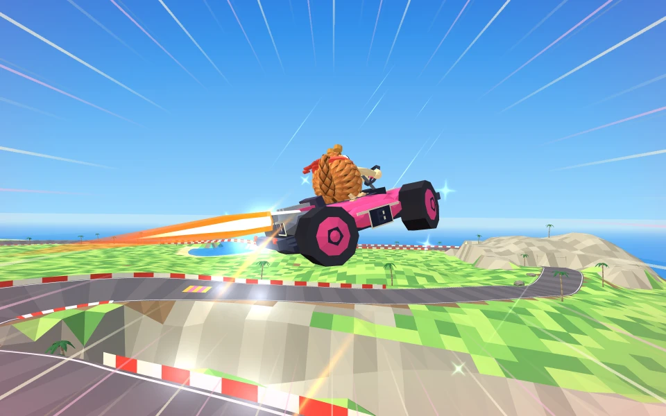Raz's pink kart gliding off the Big Air ramp with orange boost flames trailing behind it, high above the road and the ravine, with the sea in the distance.